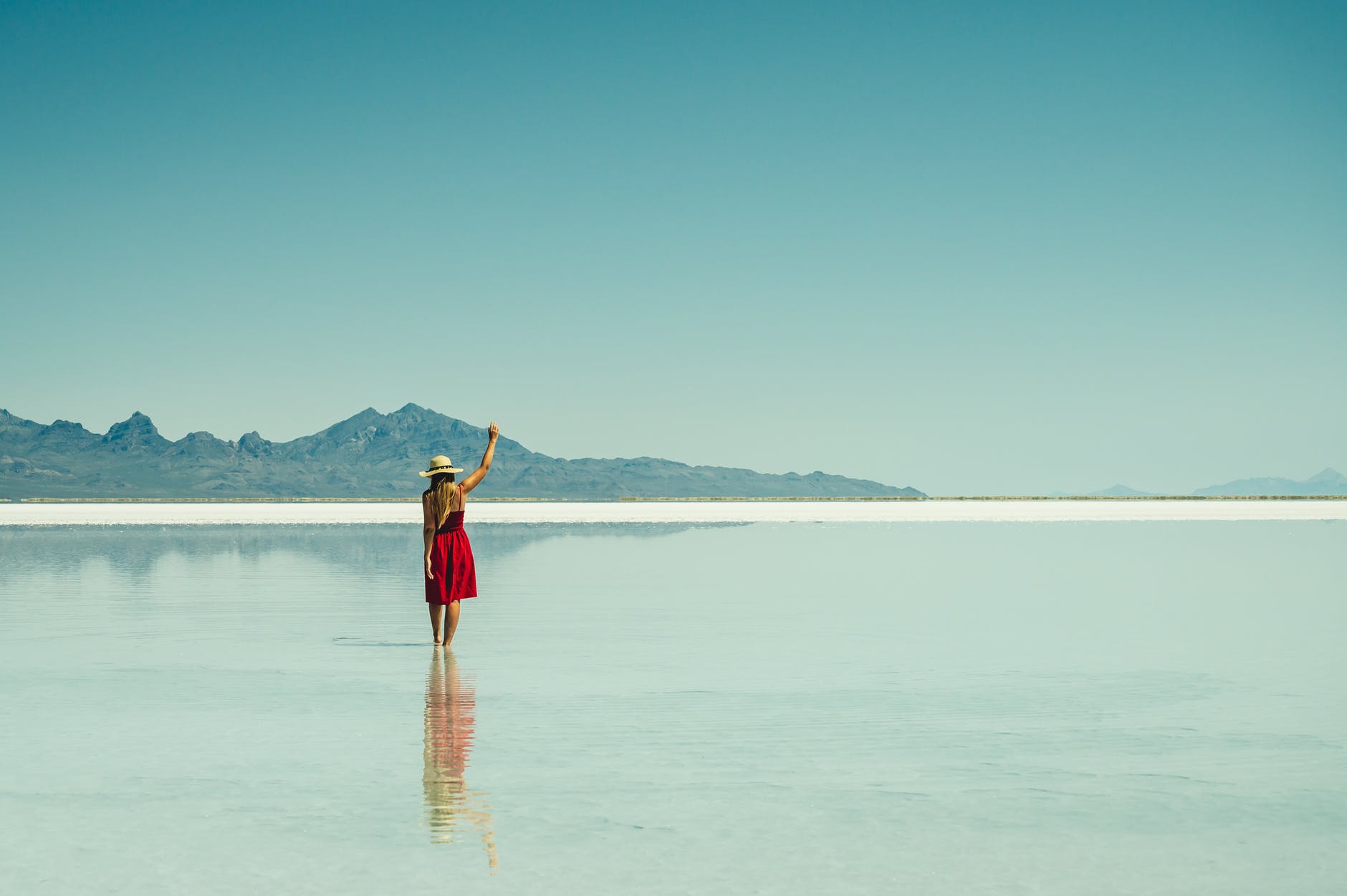 photo of woman wearing red dress